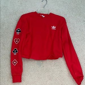 Red adidas cropped sweatshirt with patches